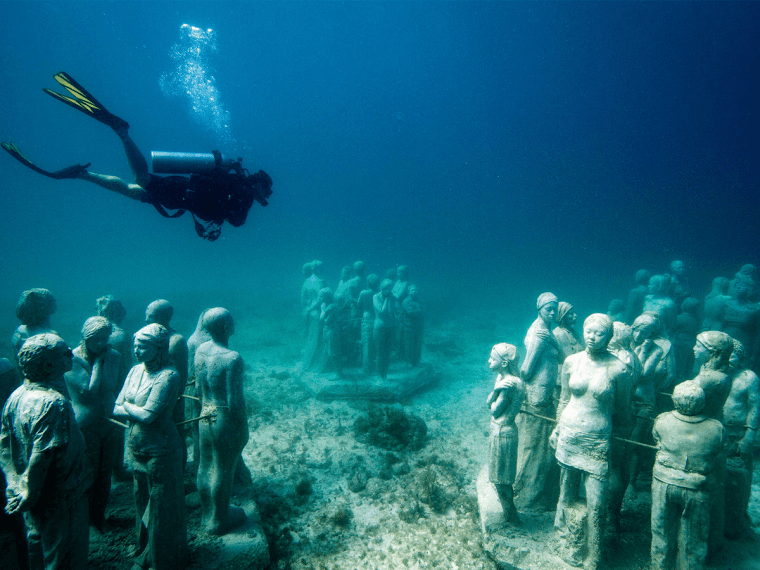 Diving into the Enchanting World: Mexicos Underwater Sculpture Museums